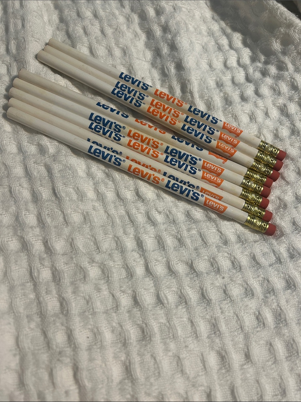 8 Levi's White Pencils with Blue & Orange Logo